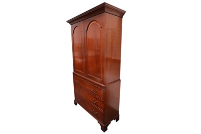 Lot 253 - A George III style mahogany linen press, with...