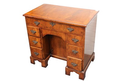Lot 257 - A George II style kneehole desk, height 74cm x...
