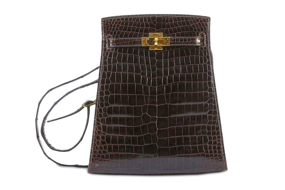 Lot 85 - Hermès Marron Crocodile Porosus Kelly Sport 20,...