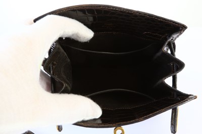 Lot 85 - Hermès Marron Crocodile Porosus Kelly Sport 20,...