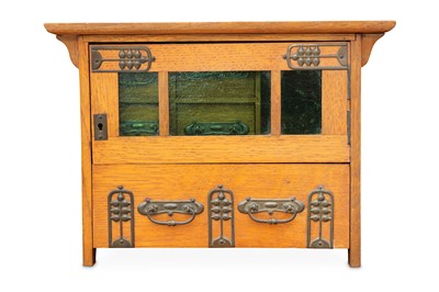 Lot 179 - An Arts & Crafts oak tabletop smokers cabinet,...