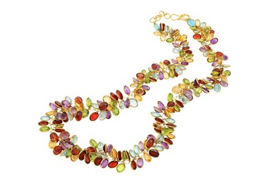 Lot 557 - A multi-gem necklace  Spectacle-set with...