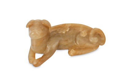 Lot 234 - A CHINESE RUSSET JADE CARVING OF A DOG. Song /...