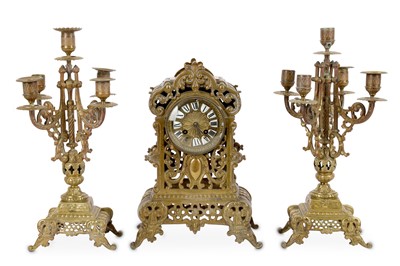 Lot 173 - A French brass clock garniture, with striking...