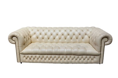 Lot 207 - A cream leather three seater Chesterfield sofa,...
