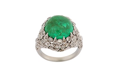 Lot 130 - An emerald and diamond dress ring The claw-set...