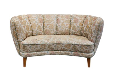 Lot 6 - DENMARK: A concave Sofa, 1940s, floral fabric,...