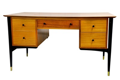 Lot 101 - A DESK: early 1960s, beech and ebonised wood...