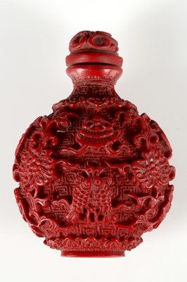 Lot 177 - A Chinese red avoid snuff bottle, fish, bats,...