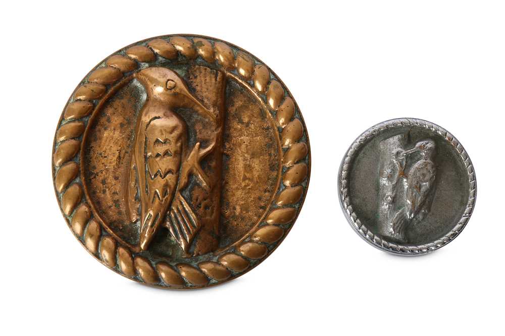 Lot 177 - An HMS Warspite brass roundel of a woodpecker...