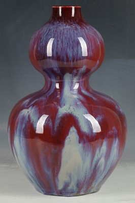 Lot 165 - A Chinese gouda vase, ox blood glaze with...