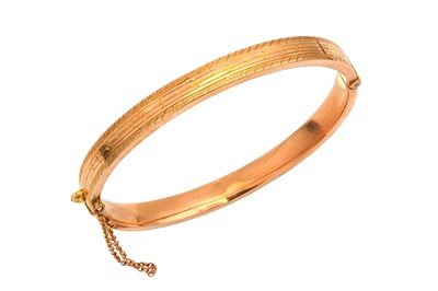 Lot 541 - A 9ct gold bangle, 1923-24 The hinged bangle,...