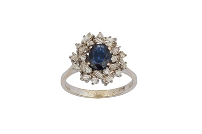 Lot 57 - A sapphire and diamond cluster ring The...