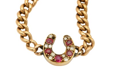 Lot 552 - A ruby and diamond bracelet Centred by a horse-...