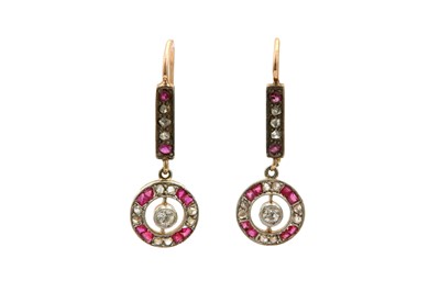 Lot 529 - A pair of ruby and diamond earrings Each of...