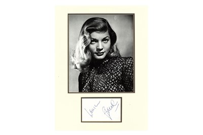 Lot 92 - Bacall (Lauren) Blue ink signature on white...