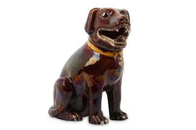 Lot 29 - A CHINESE RED-GLAZED MODEL OF A DOG. Qing...