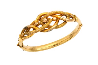 Lot 531 - A hinged bangle The front of openwork...