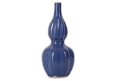 Lot 573 - A CHINESE BLUE-GLAZED DOUBLE GOURD VASE.  Ming...