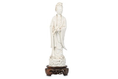 Lot 594 - A CHINESE BLANC-DE-CHINE FIGURE OF GUANYIN....