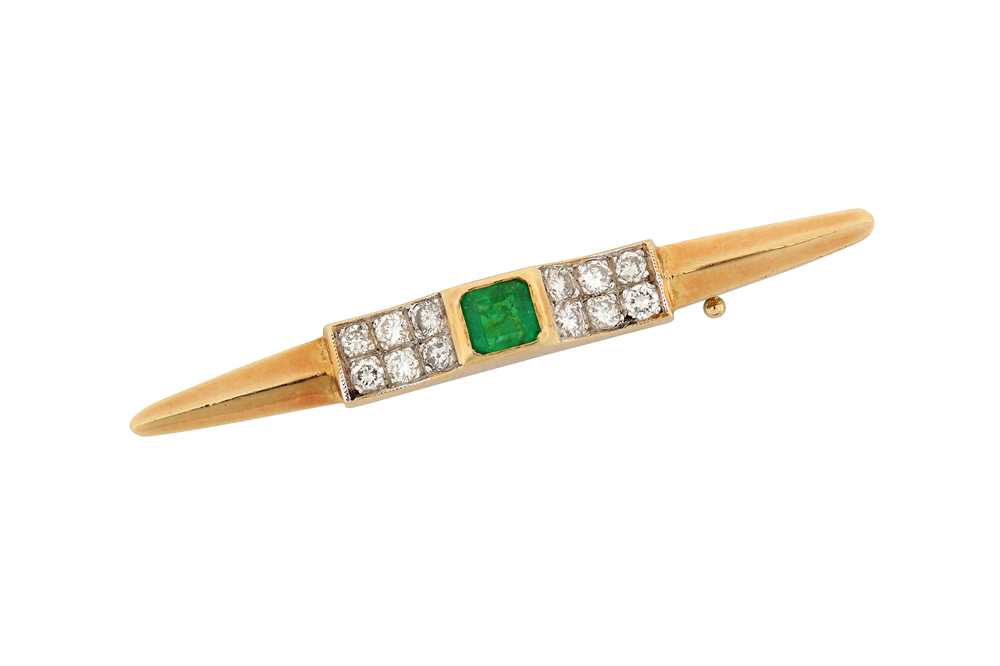 Lot 561 - An emerald and diamond bar brooch Centrally...