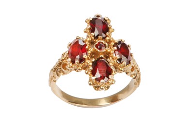 Lot 551 - A garnet dress ring, 1972 Set with a...