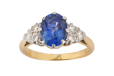 Lot 107 - A sapphire and diamond ring The oval-cut...