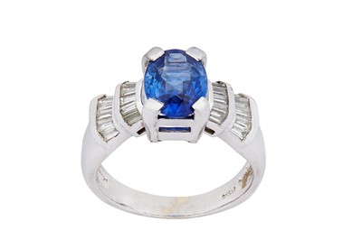 Lot 188 - A sapphire and diamond ring The oval-cut...