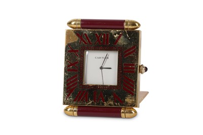 Lot 664 - A Cartier lacquered brass and burgundy mounted...