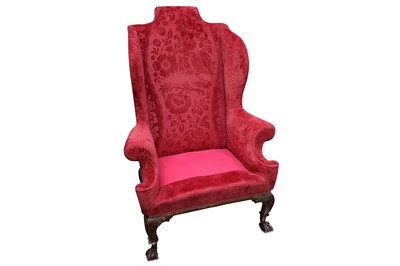 Lot 348 - A George II style wing armchair, upholstered...