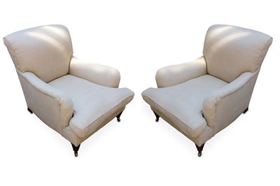 Lot 337 - A pair of cream upholstered easy arm chairs,...