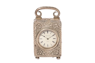 Lot 79 - AN EARLY 20TH CENTURY SILVER TRAVELLING CLOCK...