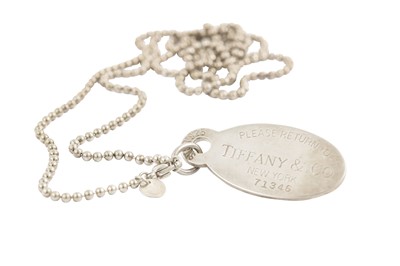 Lot 549 - A pendant necklace, by Tiffany & Co. The oval...