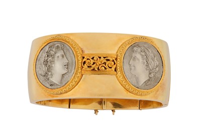 Lot 157 - A hinged cameo bangle The wide bracelet...