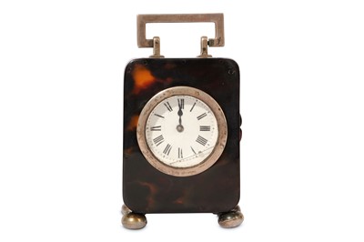 Lot 565 - AN EARLY 20TH CENTURY TORTOISESHELL AND SILVER TRAVELLING CLOCK