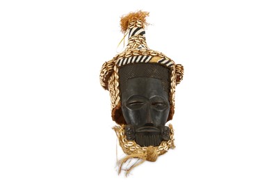 Lot 809 - A CHOKWE STYLE MASK With stylised facial...