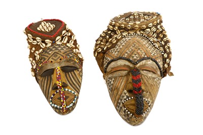 Lot 812 - TWO CHOKWE STYLE MASKS Both highly decorated,...