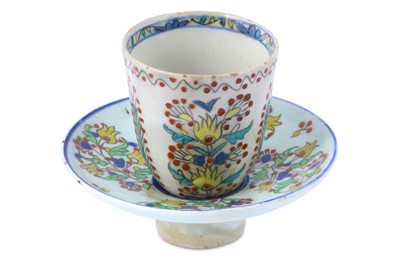 Lot 179 - A KUTAHYA POTTERY COFFEE CUP WITH HOLDER ...