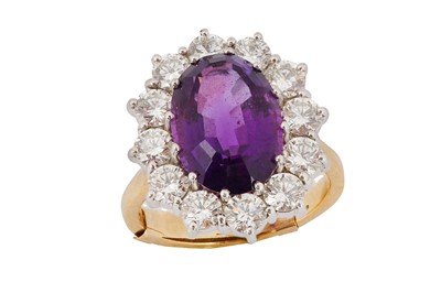 Lot 101 - An amethyst and diamond cluster ring The...