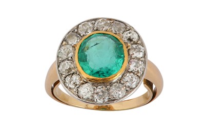 Lot 126 - An emerald and diamond cluster ring The...