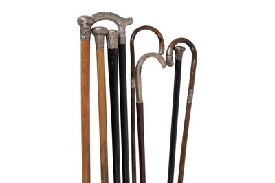 Lot 1009 - Seven walking sticks with silver handles or...