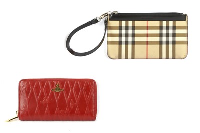 Lot 426 - Two Designer Wallets, the first a Burberry...