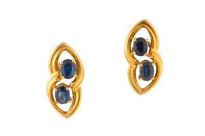 Lot 141 - A pair of sapphire earclips Each set with two...