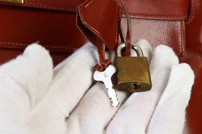 Lot 29 - Hermès Oxblood Box Kelly Retourné 35, 1960s,...