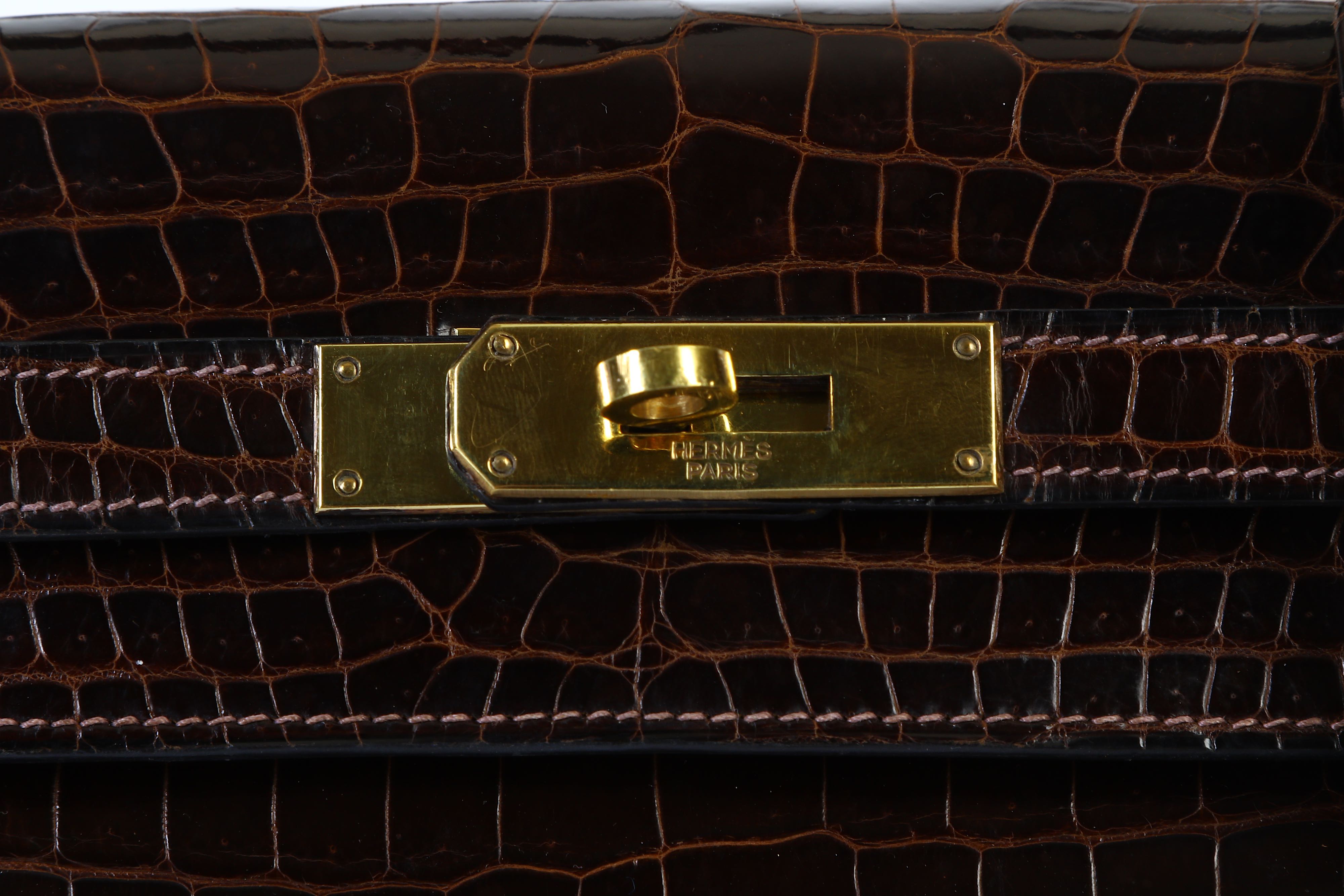 Lot 95 - Hermès Dark Brown Crocodile Kelly Sellier 28,