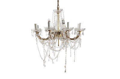 Lot 211 - A clear glass eight branch chandelier, with a...