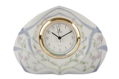 Lot 775 - A Lladro porcelain table clock, model name...