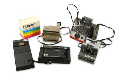 Lot 929 - A Group of Polaroid Cameras and Accessories...