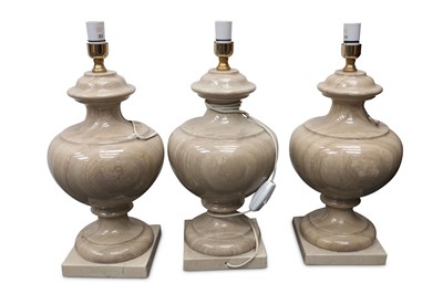 Lot 459 - A set of three beige marble table lamp bases,...