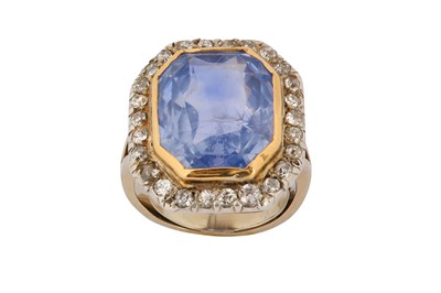 Lot 28 - A sapphire and diamond ring  The cut-cornered...